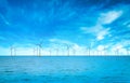 Offshore Wind Turbine in a Windfarm under construction off the England Coast at blue sky Royalty Free Stock Photo