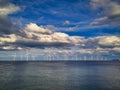 Offshore Wind Turbine in a Windfarm under construction off the England Coast at sunset Royalty Free Stock Photo