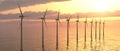 Offshore wind turbines against a sunny sky Royalty Free Stock Photo