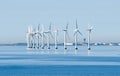 Offshore wind turbines on the coast of Copenhagen in Denmark with the airport in the background Royalty Free Stock Photo