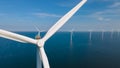 Huge windmill turbines, Offshore Windmill farm in the ocean Westermeerwind park , windmills isolated at sea on a Royalty Free Stock Photo