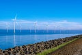 offshore windmill park with clouds and a blue sky, windmill park in the ocean drone aerial view with wind turbine