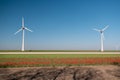 Offshore windmill park green energy in the Netherlands Europe, wind mill turbines at sea and land providing green energy Royalty Free Stock Photo