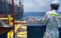 Offshore worker doing anchor handling job Royalty Free Stock Photo