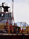 Offshore worker prepared to boarding personal safety basket hanging in the air