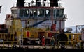 Offshore worker prepared to boarding personal safety basket hanging in the air