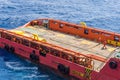 Offshore workers or riggers assisting placement of anchor buoy on deck of an anchor handling tug boat Royalty Free Stock Photo