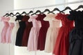 offtheshoulder dresses lined up on a sleek rack Royalty Free Stock Photo