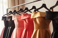 offtheshoulder dresses lined up on a sleek rack Royalty Free Stock Photo