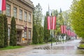 Ogre city is decorated with national flags. Post office building. Ogre. Latvia. May 2, 2020.