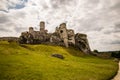 Medieval castle ruins on the green hill Royalty Free Stock Photo