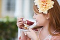 Oh I love my tea time. A little girl playing dress up and having a tea party in her garden. Royalty Free Stock Photo