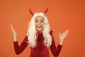 oh my god. surprised child in devil horns. kid has long white hair wig. childhood happiness. teen girl ready to Royalty Free Stock Photo