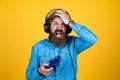 oh no. console controller joystick. gaming in earphones. mature man gamer play computer games. guy with beard playing Royalty Free Stock Photo