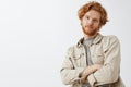 Oh not impressive. Portrait of cool snobbish redhead guy with wavy hair and beard tilting backwards with hands crossed