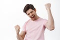 Oh yeah baby. Smiling satisfied man celebrated success, making fist pump like champion, winning and celebrating Royalty Free Stock Photo