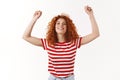 Oh yes, sweet success. Attractive cheerful redhead curly glamour girl striped t-shirt enjoy summer jumping dancing