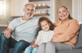 Ohana means family and family means nobody gets left behind. a happy senior couple and their granddaughter relaxing on