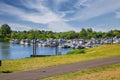 Beautiful dutch countryside landscape, cyling path, river Maas inalnd harbor, green forest