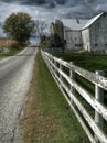 Ohio Amish Country with a barn and a white fence