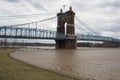 Ohio River above flood stage and John Roebling Suspension Bridge