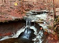 Ohio Waterfall in Winter with Leaves and Light Flare