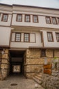 OHRID, NORTH MACEDONIA: Passageway for people and cars in the form of a tunnel inside an old house on a street Royalty Free Stock Photo