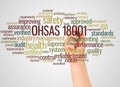 OHSAS 18001 word cloud and hand with marker concept Royalty Free Stock Photo