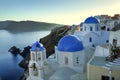 Oia blue dome church in Santorini Island, Greece Royalty Free Stock Photo