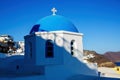 Oia church with cupola painted blue, Santorini island in Greece. Royalty Free Stock Photo