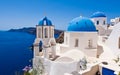 Oia Orthodox churches and the bell tower on Santorini island, Greece. Royalty Free Stock Photo