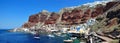 Oia, a panoramic view from the coast of Port Amoudi. The island of Santorini, Greece. Royalty Free Stock Photo