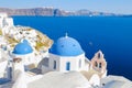 Oia Santorini Greece on a sunny day during summer with whitewashed homes and churches, Greek Island Royalty Free Stock Photo