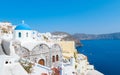 Oia Santorini Greece on a sunny day during summer with whitewashed homes and churches, Greek Island Royalty Free Stock Photo