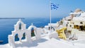 Oia Santorini Greece on a sunny day during summer with whitewashed homes and churches, Greek Island Royalty Free Stock Photo