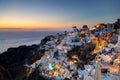 Oia town on Santorini island, Greece at sunset. Royalty Free Stock Photo
