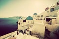 Oia town on Santorini island, Greece at sunset. Vintage Royalty Free Stock Photo