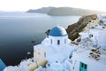 Oia town on Santorini island, Greece. Traditional and famous houses and churches with blue domes over the Caldera, Aegean sea, Royalty Free Stock Photo