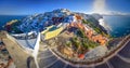 Oia town on Santorini island, Greece. Traditional and famous houses and churches with blue domes over the Caldera. Royalty Free Stock Photo