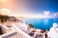 Oia town on Santorini island, Greece. Traditional and famous houses and churches with blue domes over the Caldera. Royalty Free Stock Photo