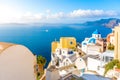Oia town on Santorini island, Greece. Traditional and famous houses and churches with blue domes over the Caldera, Aegean sea Royalty Free Stock Photo