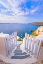 Oia town on Santorini island, Greece. Traditional and famous houses and churches with blue domes over the Caldera. Royalty Free Stock Photo