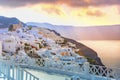 Oia town on Santorini island, Greece. Traditional and famous houses and churches with blue domes over the Caldera, Aegean sea Royalty Free Stock Photo