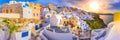 Oia town on Santorini island, Greece. Traditional and famous houses and churches with blue domes over the Caldera, Aegean sea Royalty Free Stock Photo