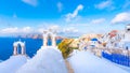 Oia town on Santorini island, Greece. Traditional and famous houses and churches with blue domes over the Caldera, Aegean sea Royalty Free Stock Photo