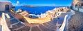 Oia town on Santorini island, Greece. Traditional and famous houses and churches with blue domes over the Caldera. Royalty Free Stock Photo