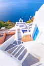 Oia town on Santorini island, Greece. Traditional and famous houses and churches with blue domes over the Caldera.