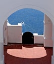 Oia town on Santorini island, Greece. Traditional and famous white houses and churches with blue domes over the Caldera Royalty Free Stock Photo