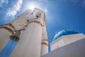 Oia village with church and belfry against blue sky on Santorini island in Greece Royalty Free Stock Photo