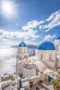 Oia village with churches against azure sea on Santorini island in Greece Royalty Free Stock Photo